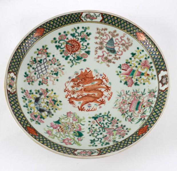 A famille rose circular dish, late 19th Century,: A famille rose circular dish, late 19th Century, painted a dragon and eight Buddhist emblems, 35.75cm diameter