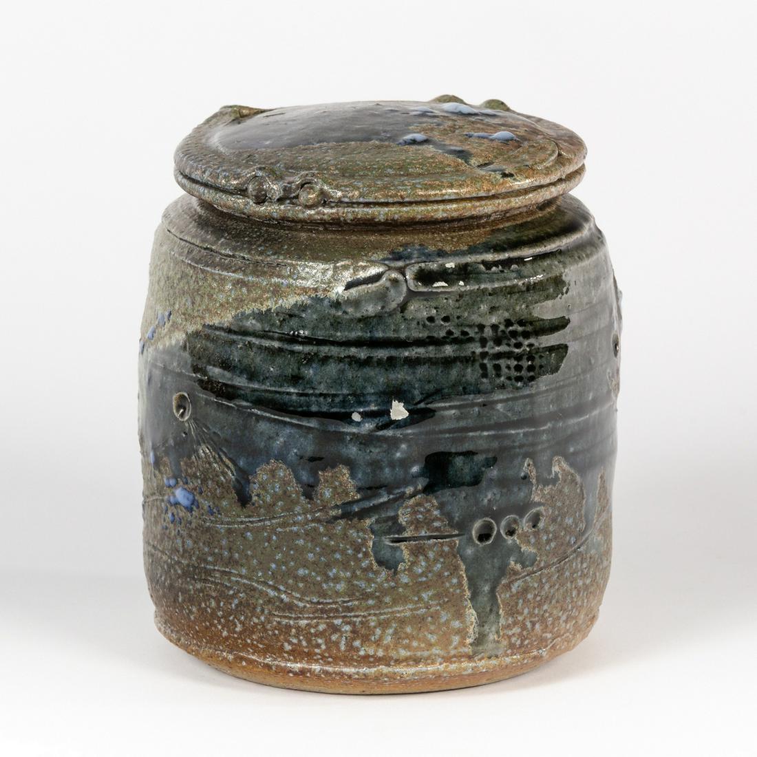 Don Reitz (American 1929-2014), a lidded stoneware jar,: Don Reitz (American 1929-2014), a lidded stoneware jar, green saltglaze incised body, painted signature, 13.5cm high