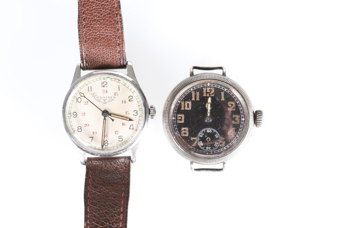 A VINTAGE LONGINES MILITARY TYPE STAINLESS STEEL: A VINTAGE LONGINES MILITARY TYPE STAINLESS STEEL WRISTWATCH, the dial with luminous markers and hands, centre sweep seconds, black numerals 1-12, red numerals 13-24, leather straps with faint impresse