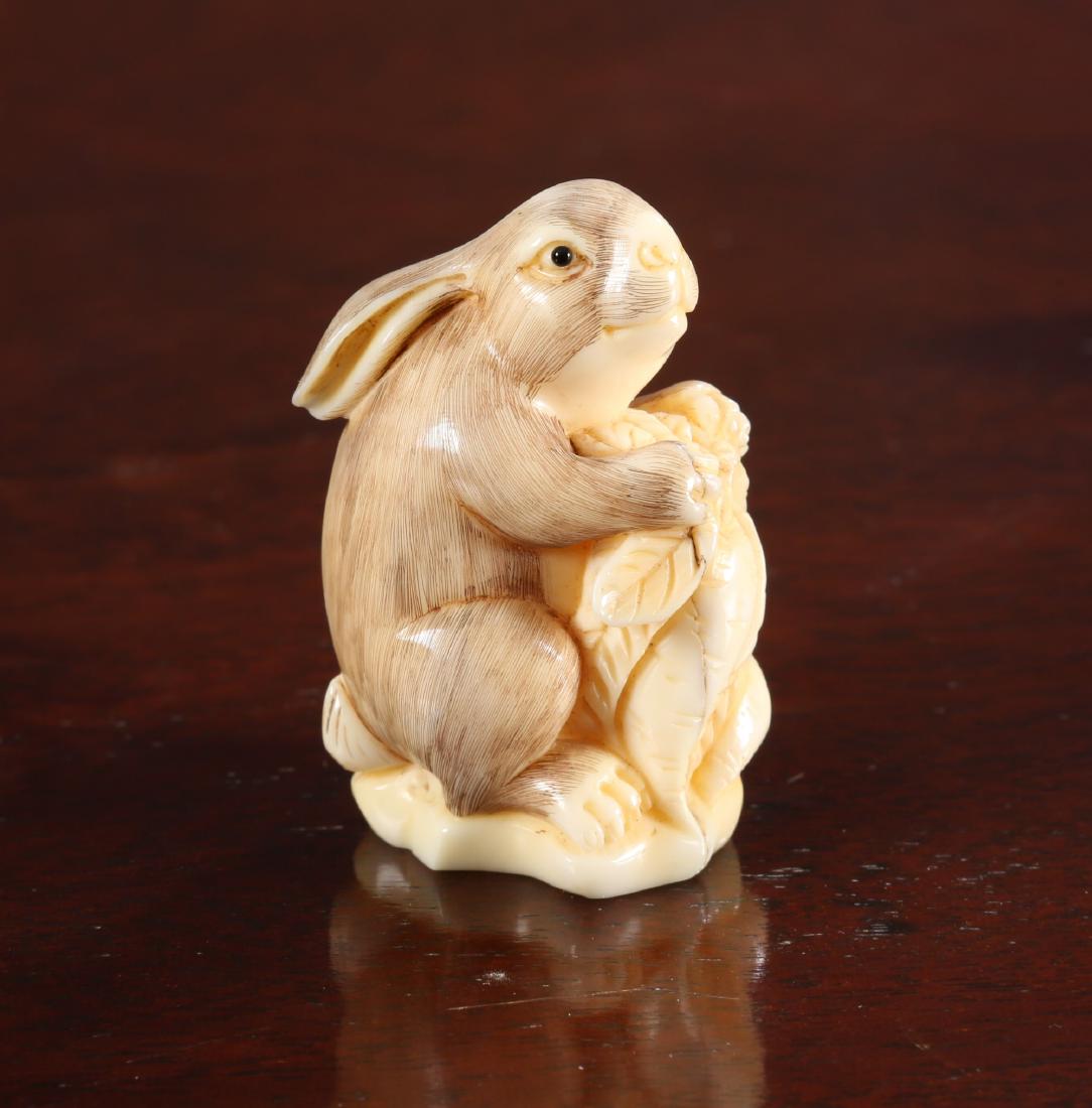 A JAPANESE NETSUKE OF A RABBIT, Meiji period, signed.: A JAPANESE NETSUKE OF A RABBIT, Meiji period, signed. 47mm