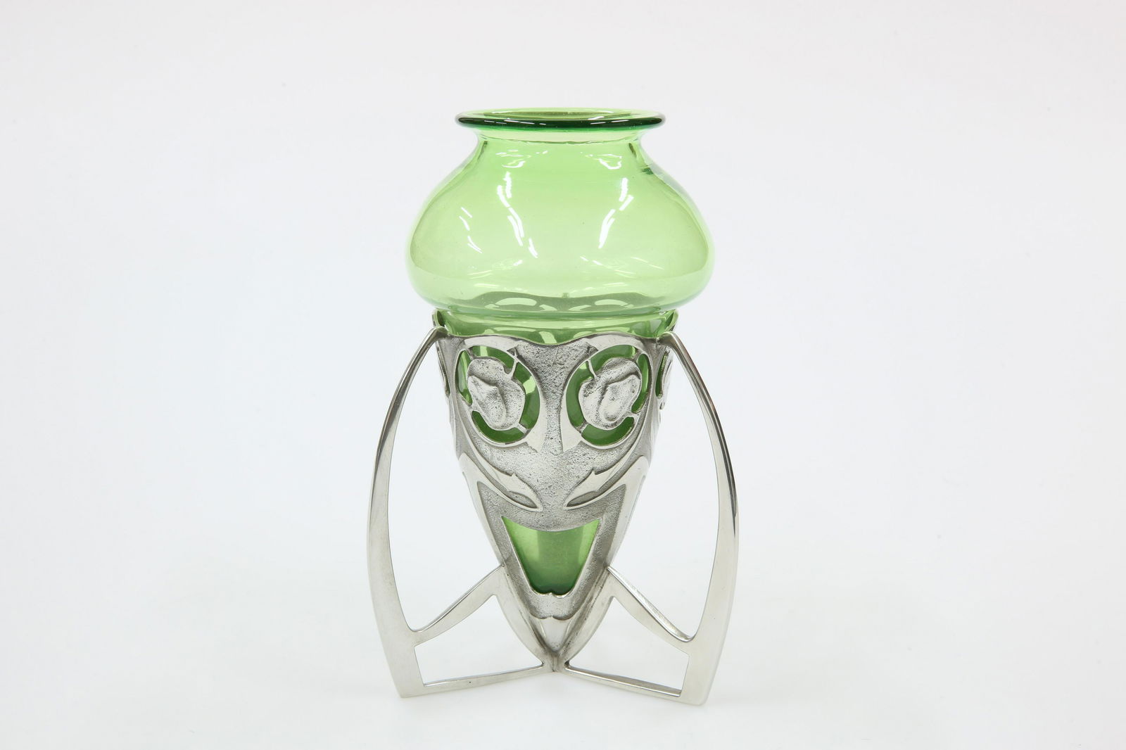 A LIBERTY & CO ENGLISH PEWTER BOMBE VASE, DESIGNED BY: A LIBERTY & CO ENGLISH PEWTER BOMBE VASE, DESIGNED BY ARCHIBALD KNOX, no. 0226, the tapering pierced body cast with stylised honesty, supported on three downswept lugs, stamped marks. 32cm