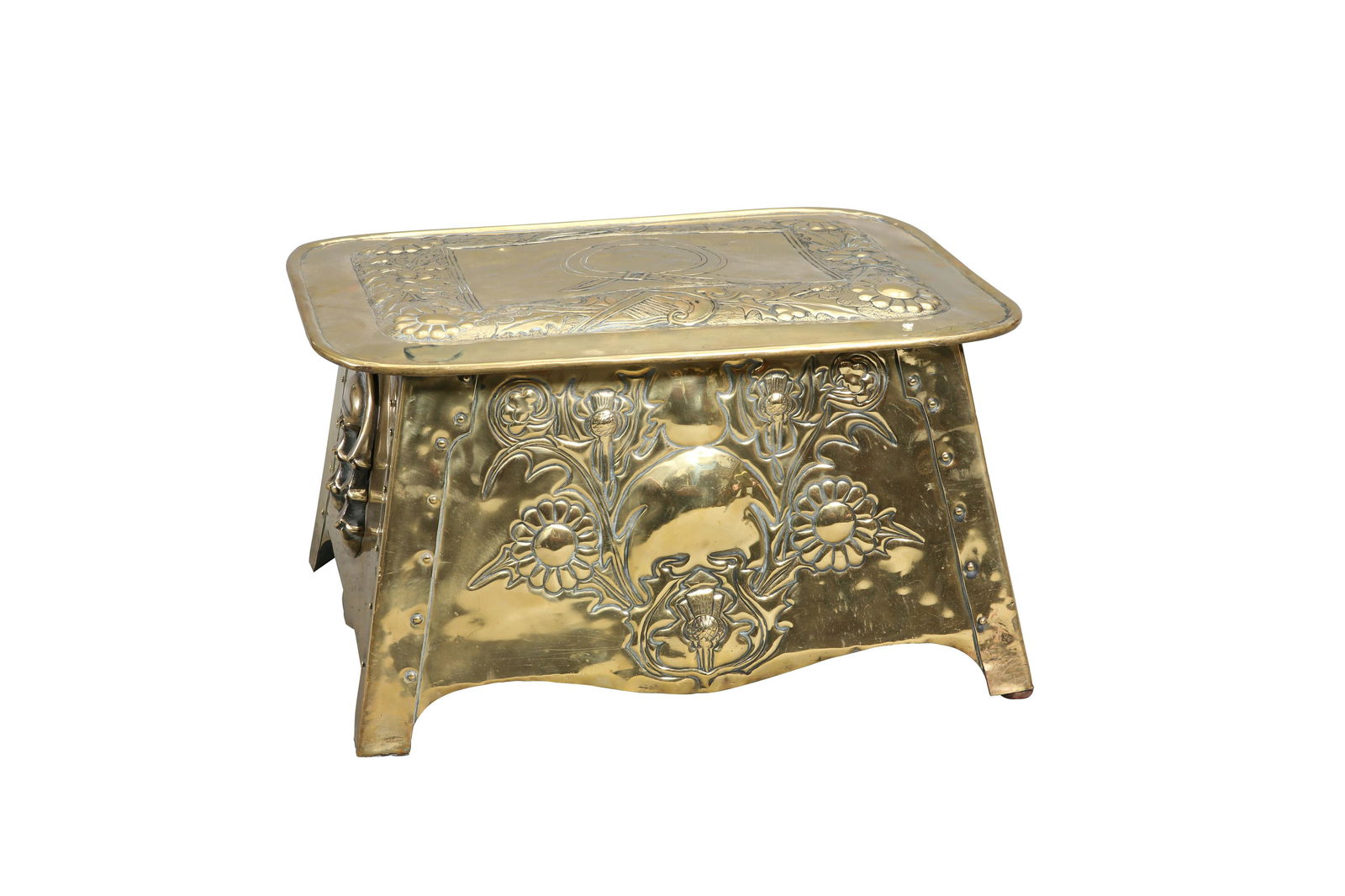 AN ARTS AND CRAFTS BRASS COAL BOX, the hinged: AN ARTS AND CRAFTS BRASS COAL BOX, the hinged rectangular lid with rounded corners, repousse with thistles, harps and stylised foliage. 30cm high, 54cm wide, 42cm deep