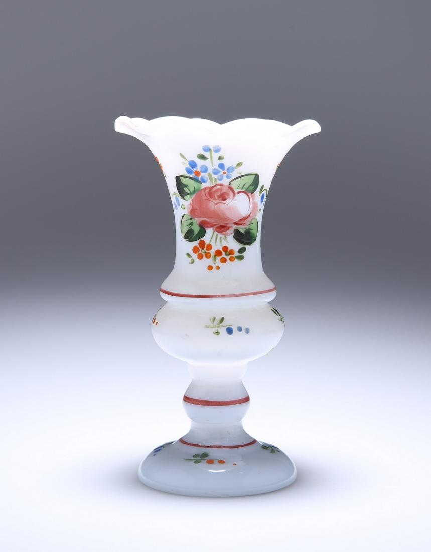 A LATE 19th CENTURY ENAMEL PAINTED MILCH GLASS VASE, of: A LATE 19th CENTURY ENAMEL PAINTED MILCH GLASS VASE, of baluster form, with scalloped rim and knopped stem, polychrome painted with floral sprays and sprigs. 13cm