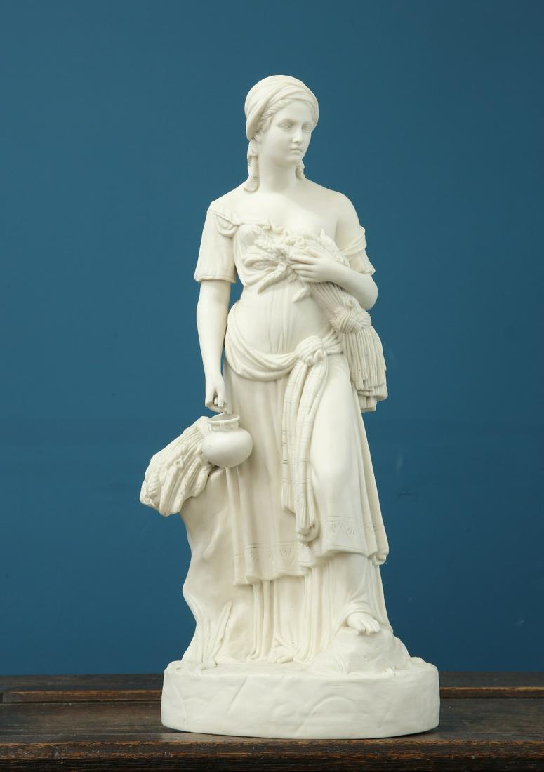 A LARGE PARIAN FIGURE EMBLEMATIC OF HARVEST, LATE 19th: A LARGE PARIAN FIGURE EMBLEMATIC OF HARVEST, LATE 19th CENTURY, possibly Minton, the female figure modelled holding a wheatsheaf, on an oval base, unmarked (losses). 51cm