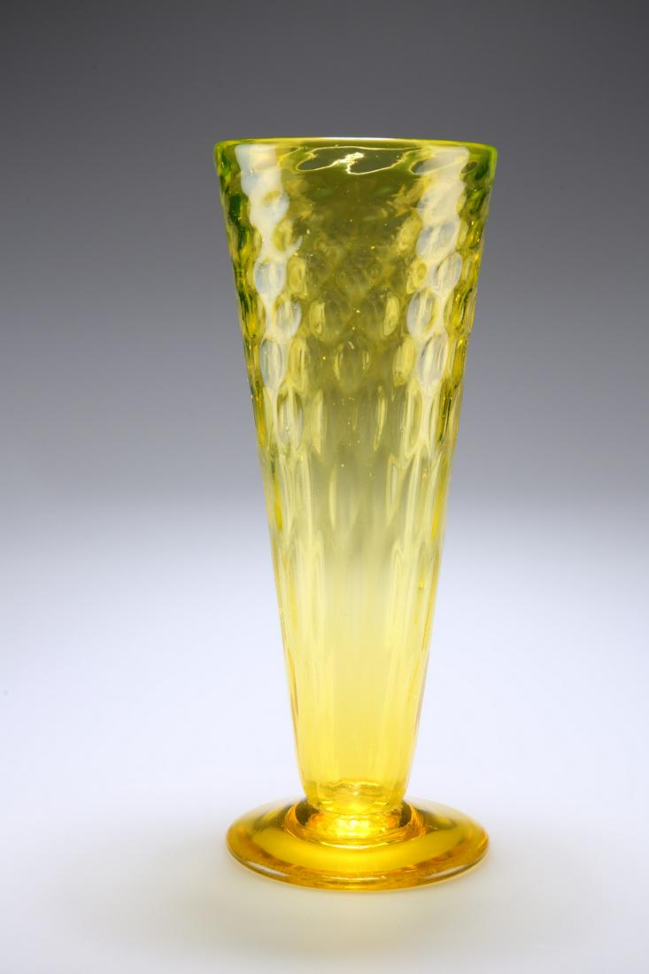 THOMAS WEBB & SONS A 1930'S "GAY GLASS" RANGE: THOMAS WEBB & SONS A 1930'S "GAY GLASS" RANGE VASE,Â of footed conical form with optic moulded spots in a wrythen pattern. 30.2cm