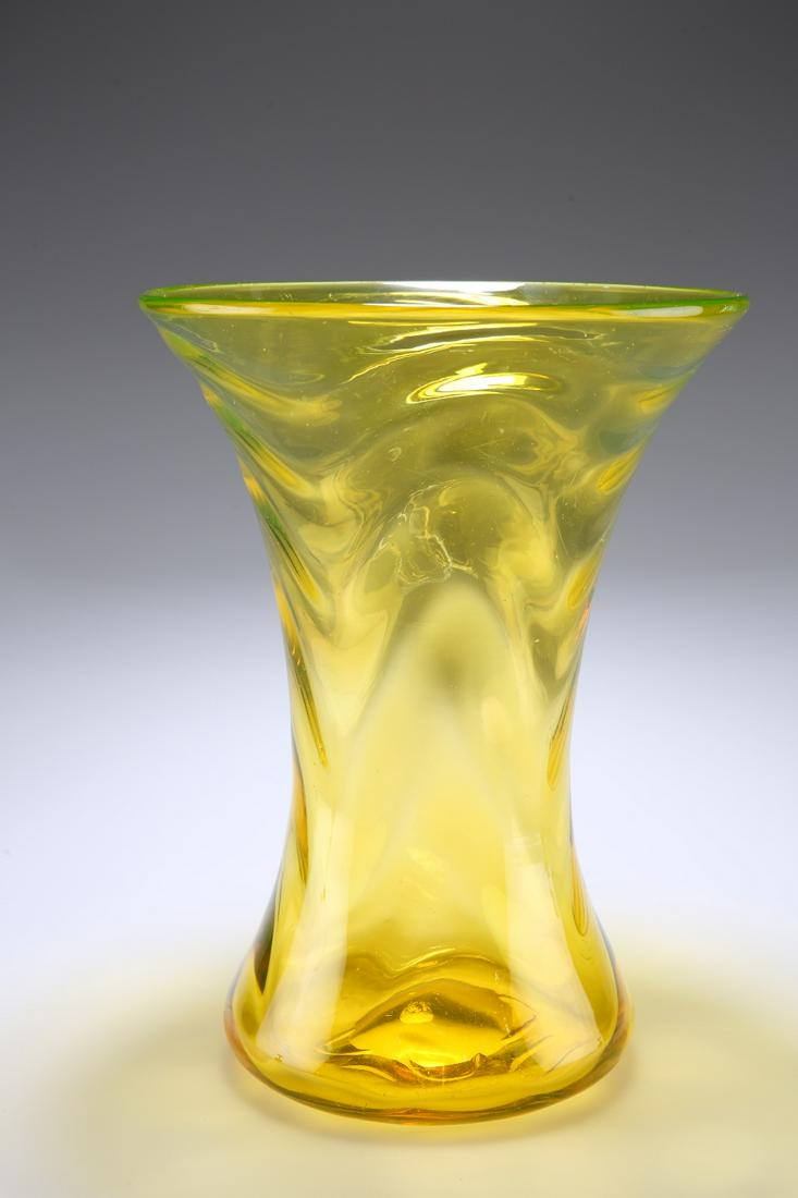 THOMAS WEBB & SONS A 1930'S "GAY GLASS" RANGE VASE, of: THOMAS WEBB & SONS A 1930'S "GAY GLASS" RANGE VASE, of waisted form in amber with opticÂ moulded waves. 27.5cm