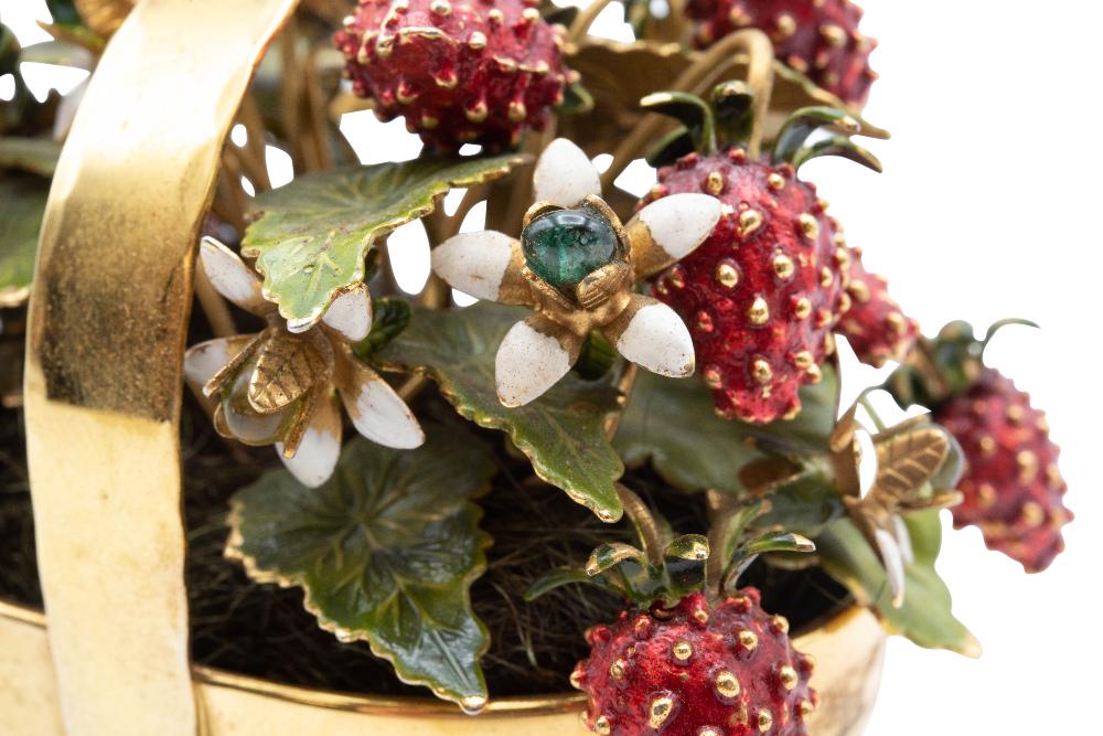 AN ENAMEL AND STERLING SILVER-GILT FRUIT BASKET, BY: AN ENAMEL AND STERLING SILVER-GILT FRUIT BASKET, BY CARTIER, CIRCA 1950, realistically designed as woven basket displaying a flowering strawberry plant, decorated in red, green and white enamel, signe