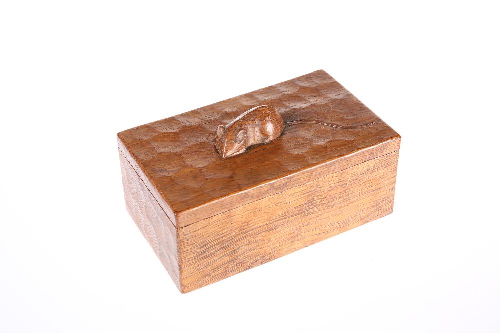 ROBERT THOMPSON OF KILBURN A MOUSEMAN OAK TRINKET BOX,: ROBERT THOMPSON OF KILBURN A MOUSEMAN OAK TRINKET BOX, MID 20TH CENTURY, rectangular with lift-off cover, adzed to all visible areas, carved mouse signature. 18cm by 11cm