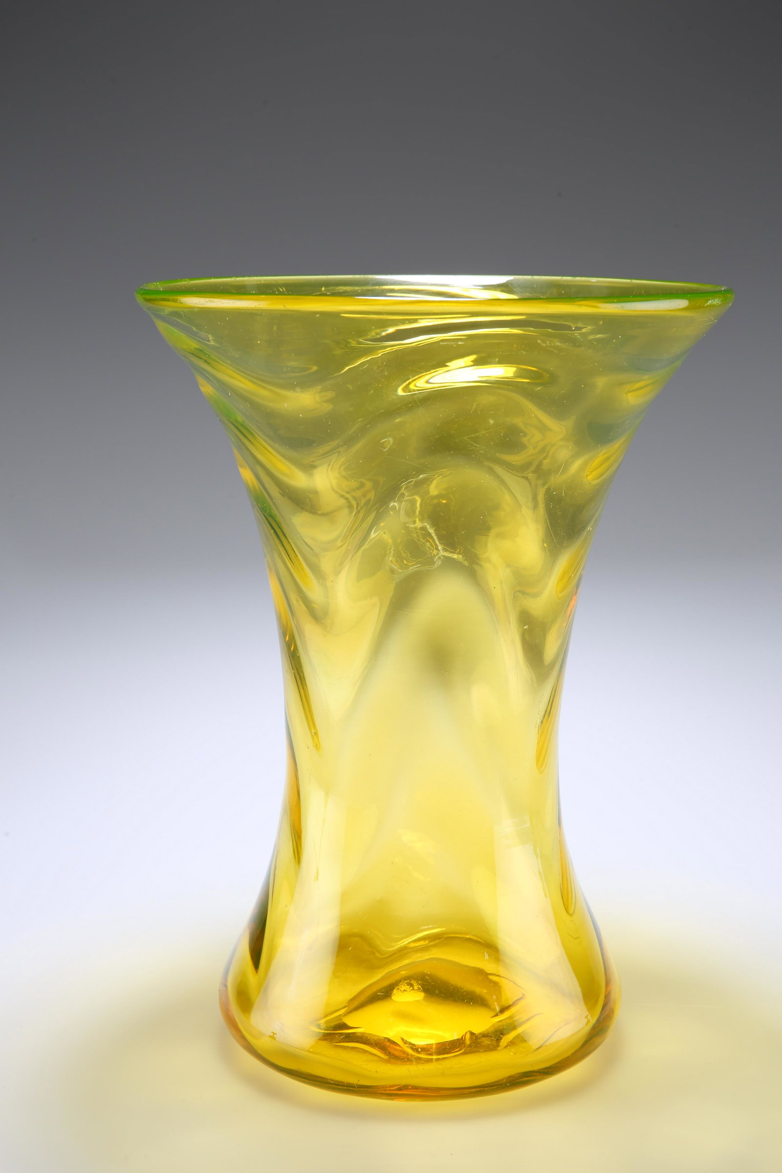 THOMAS WEBB & SONS A 1930'S "GAY GLASS" RANGE VASE: THOMAS WEBB & SONS A 1930'S "GAY GLASS" RANGE VASE Of waisted form in amber with opticÂ moulded waves. 27.5cm.
