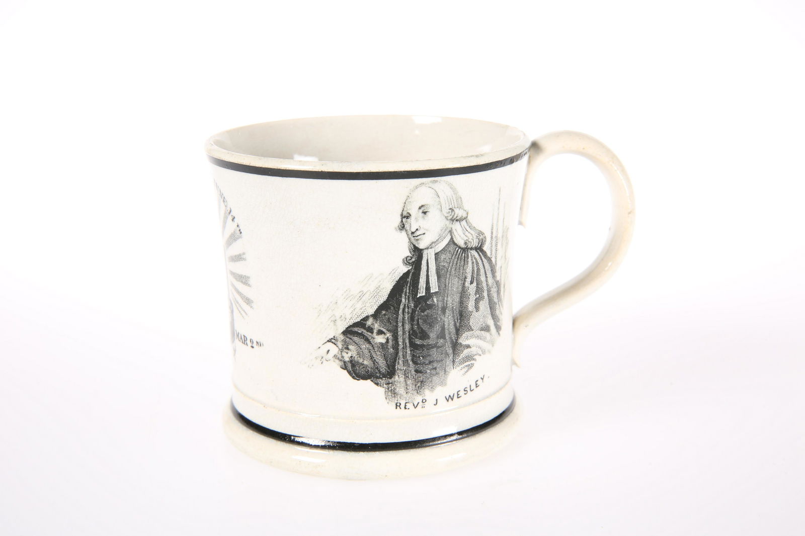 A JOHN WESLEY COMMEMORATIVE BLACK TRANSFER-PRINTED: A JOHN WESLEY COMMEMORATIVE BLACK TRANSFER-PRINTED POTTERY MUG, CIRCA 1839 Decorated with three prints including "Centenary Hall 1839 London". 7.5cm high.
