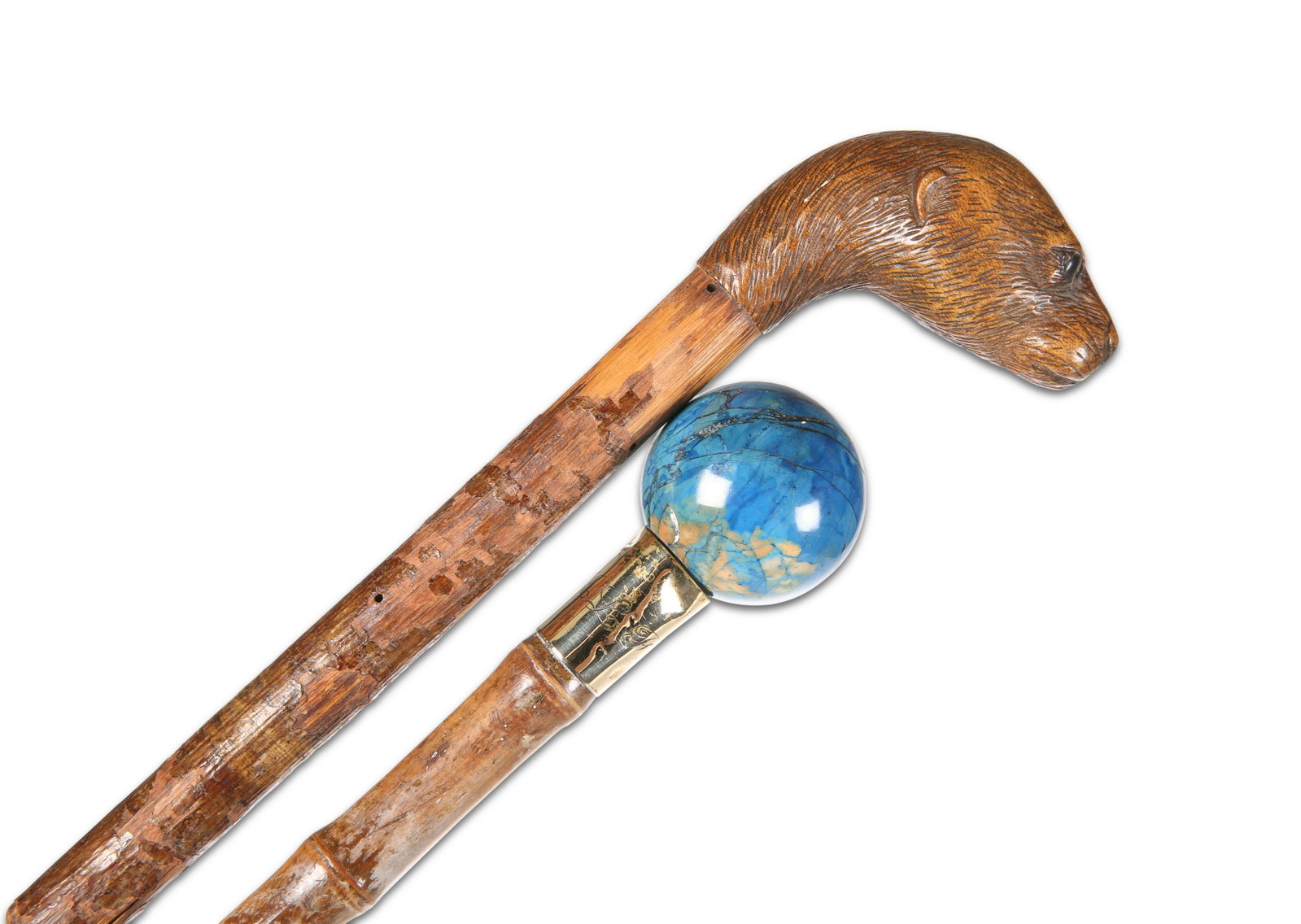 A BAMBOO CANE WITH LAPIS LAZULI HANDLE, the yellow: A BAMBOO CANE WITH LAPIS LAZULI HANDLE, the yellow metal collar with the initials MLF, 92.5cm long; together with A PARASOL WITH CARVED BEAVER HANDLE, 92.5cm long. (2)