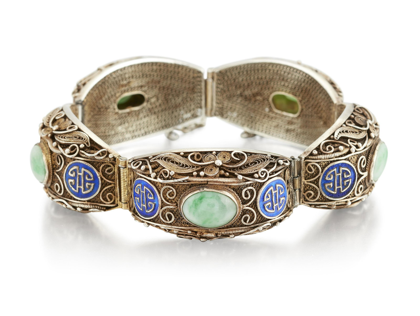 A CHINESE SILVER-GILT JADE AND ENAMEL BRACELET, the: A CHINESE SILVER-GILT JADE AND ENAMEL BRACELET, the broad filigree links set with an oval jade cabochon and blue enamel Chinese character roundels to either side, clasp stamped 'SILVER', 22cm long, 41