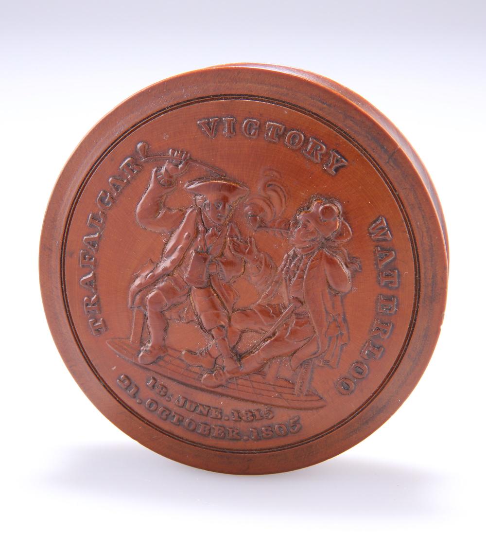 TRAFALGAR AND WATERLOO AN IMPRESSED FRUITWOOD SNUFF: TRAFALGAR AND WATERLOO AN IMPRESSED FRUITWOOD SNUFF BOX, BY JOHN WESTWOOD, CIRCA 1815, circular. Diameter 7cm
