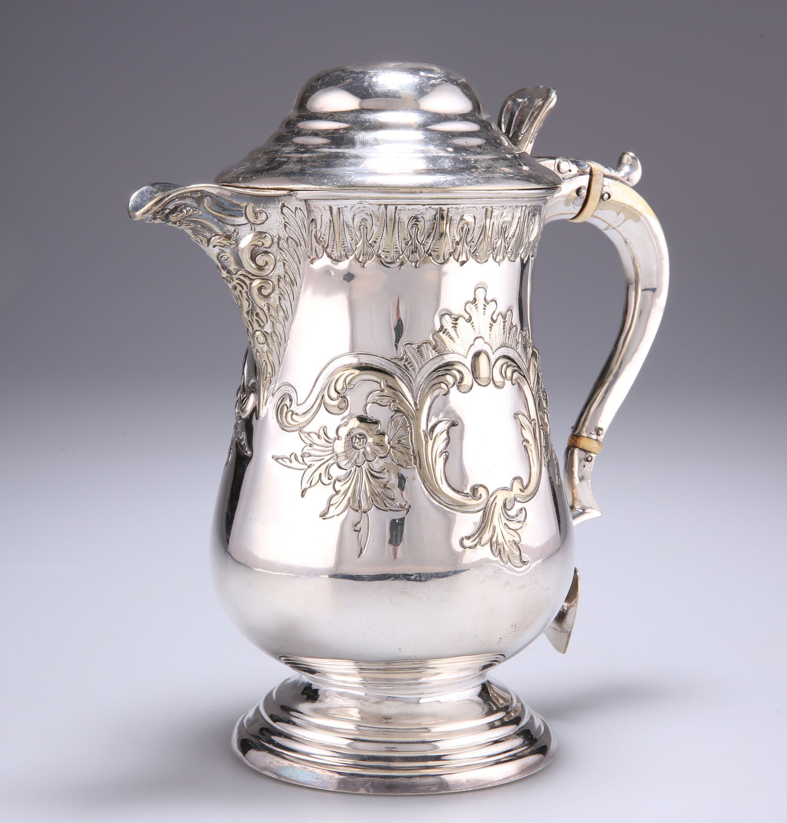 A 19TH CENTURY SILVER-PLATED FLAGON, baluster form with (1 of 2)