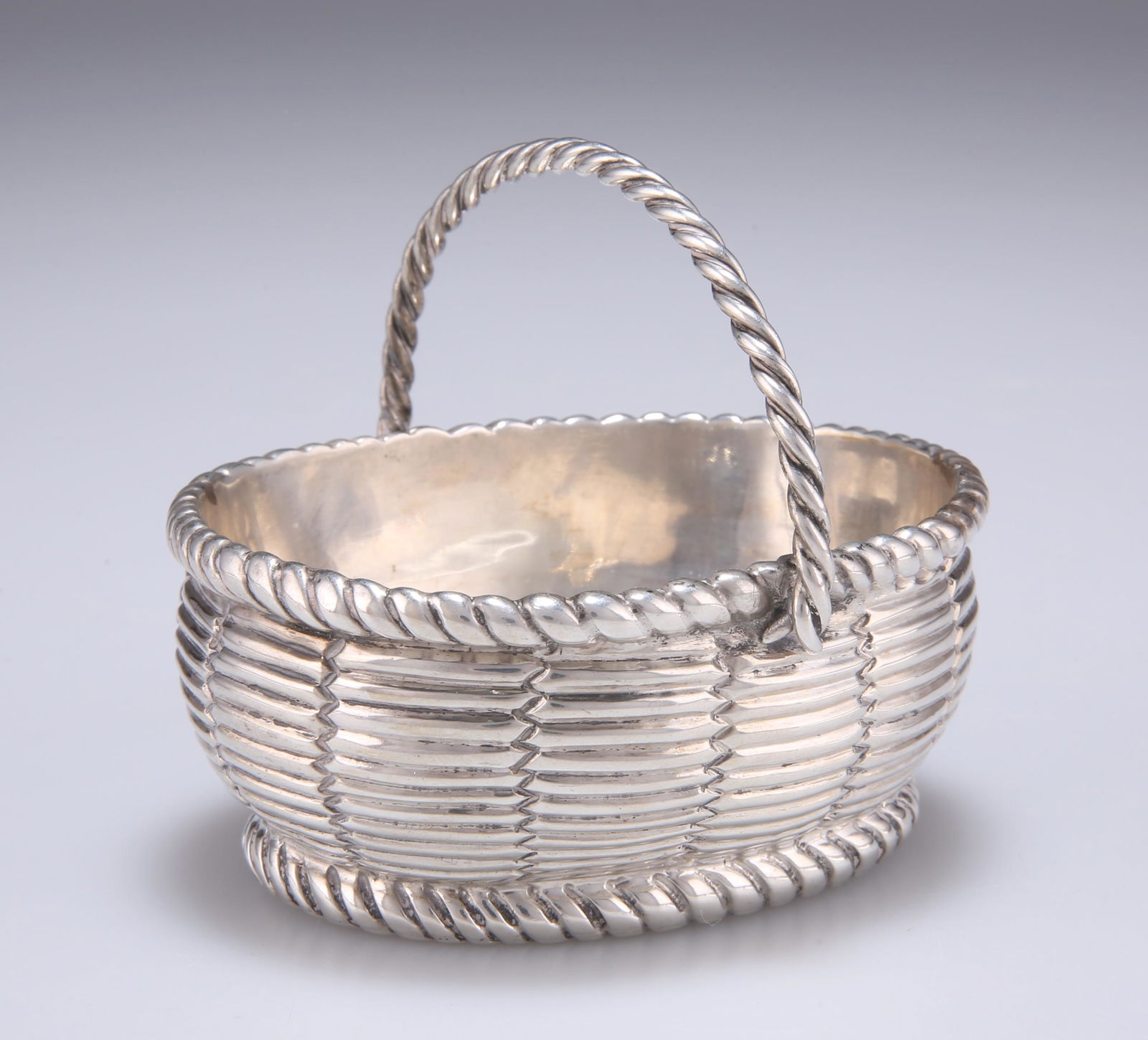 A SMALL VICTORIAN NOVELTY SILVER DISH, by Charles: A SMALL VICTORIAN NOVELTY SILVER DISH, by Charles Stuart Harris, London 1869, in the form of a basket. 8.5cm long, 3.8 troy ounces