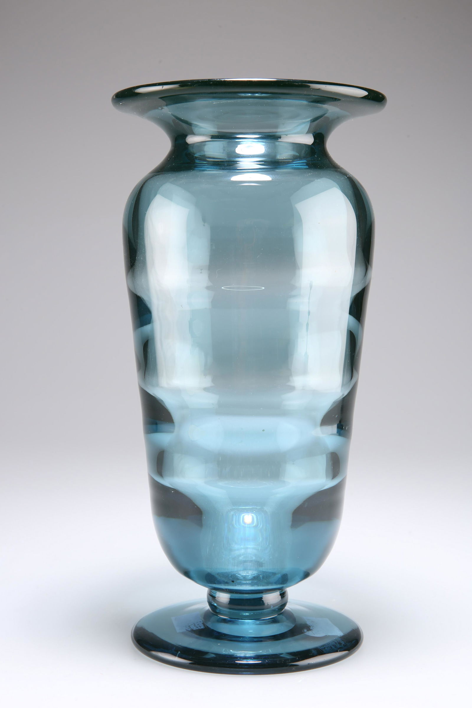 ELIS BERGH FOR KOSTA, A BLUE RIBBED OPTIC GLASS VASE,: ELIS BERGH FOR KOSTA, A BLUE RIBBED OPTIC GLASS VASE, CIRCA 1930S, of baluster form with a flared neck rim and a spread circular foot, etched 'B.327' to base. 29cm high