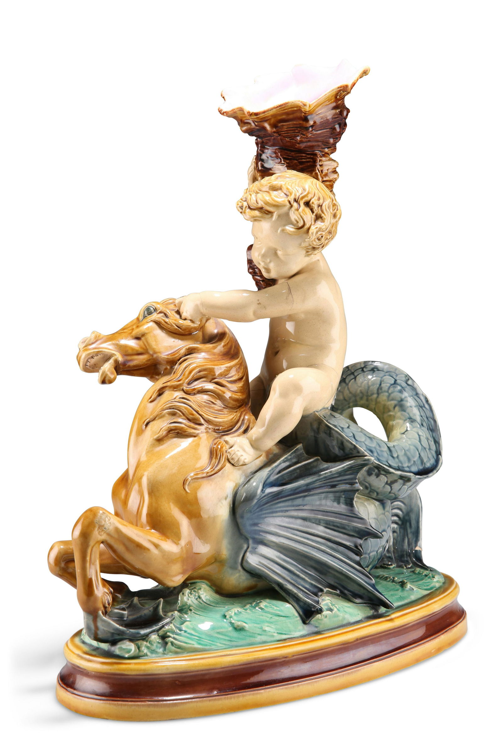A MINTON MAJOLICA GROUP OF A PUTTO, CIRCA 1874, riding (1 of 3)