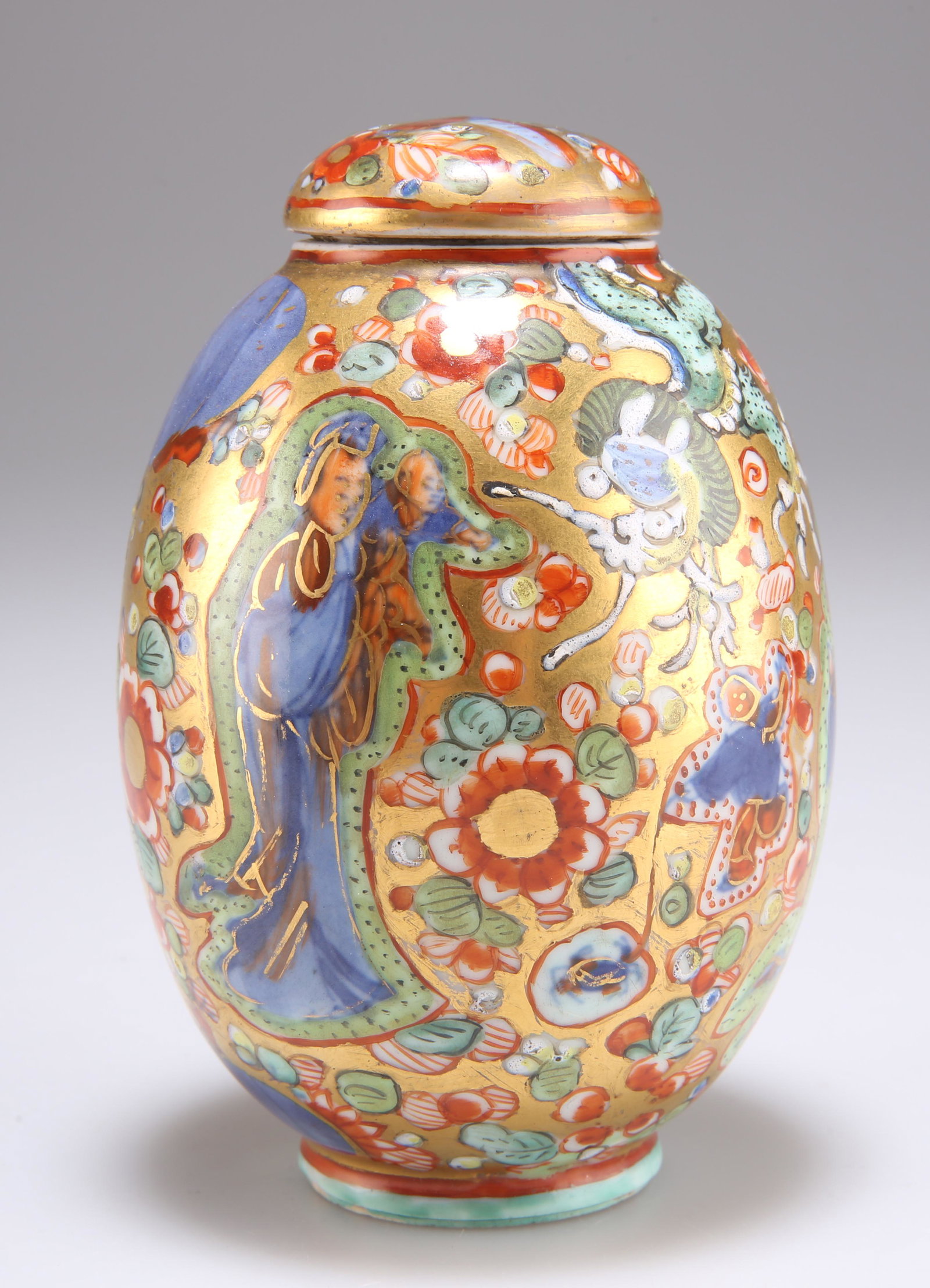 A CHINESE CLOBBERED PORCELAIN JAR AND COVER, KANGXI,: A CHINESE CLOBBERED PORCELAIN JAR AND COVER, KANGXI, ovoid, decorated with figures, dragon and scattered flowers, underglaze blue artemisia leaf mark. 11cm high