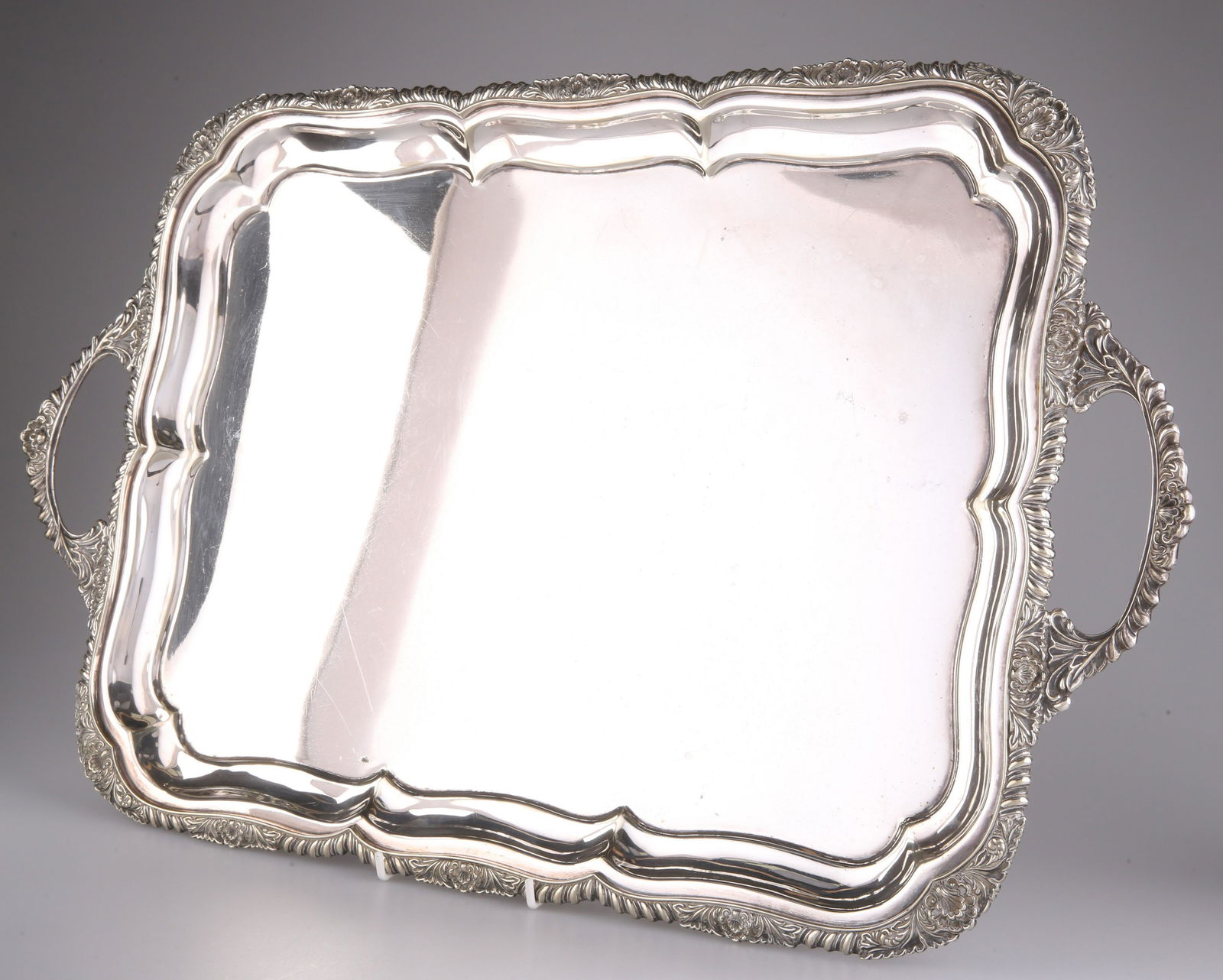 A LARGE 19TH CENTURY SILVER-PLATED SALVER, oval, with (1 of 2)