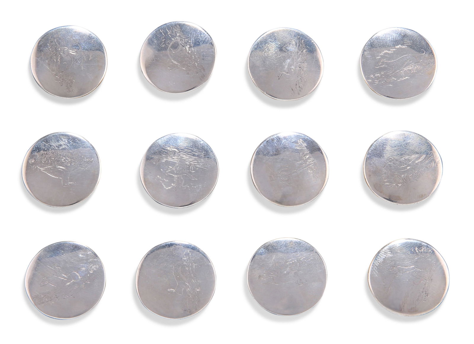 A SET OF TWELVE GEORGE III SILVER HUNT BUTTONS, some: A SET OF TWELVE GEORGE III SILVER HUNT BUTTONS, some marked for William Stroud, engraved with sportsmen, hounds and gamebirds. 2.5cm diameter, 3 troy ounces