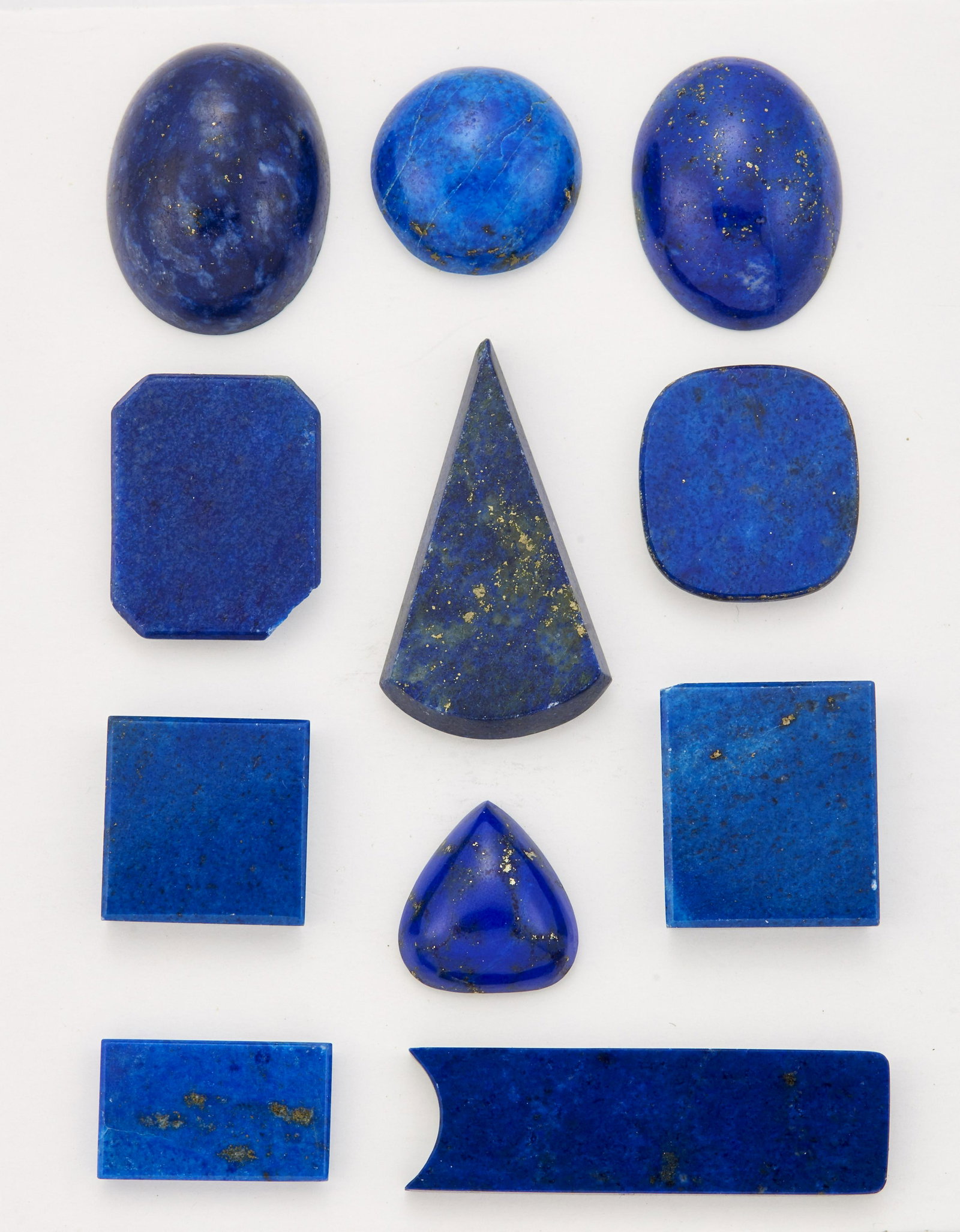 ELEVEN PIECES OF WORKED LAPIS LAZULI, including oval: ELEVEN PIECES OF WORKED LAPIS LAZULI, including oval cabochons. (11)