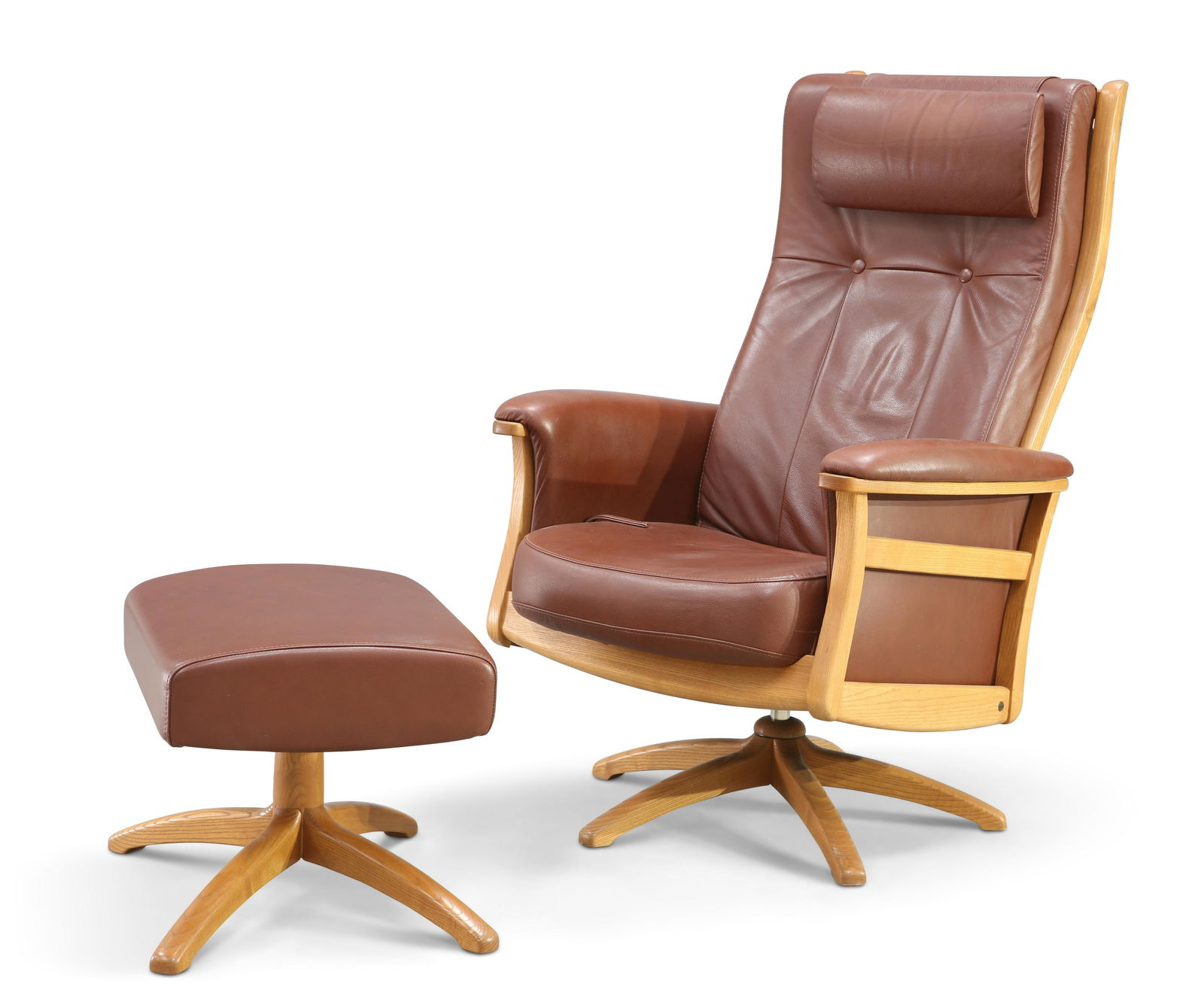 AN ERCOL LEATHER UPHOLSTERED RECLINING SWIVEL ARMCHAIR,: AN ERCOL LEATHER UPHOLSTERED RECLINING SWIVEL ARMCHAIR, with footstool en-suite. (2) Height of chair back 113cm