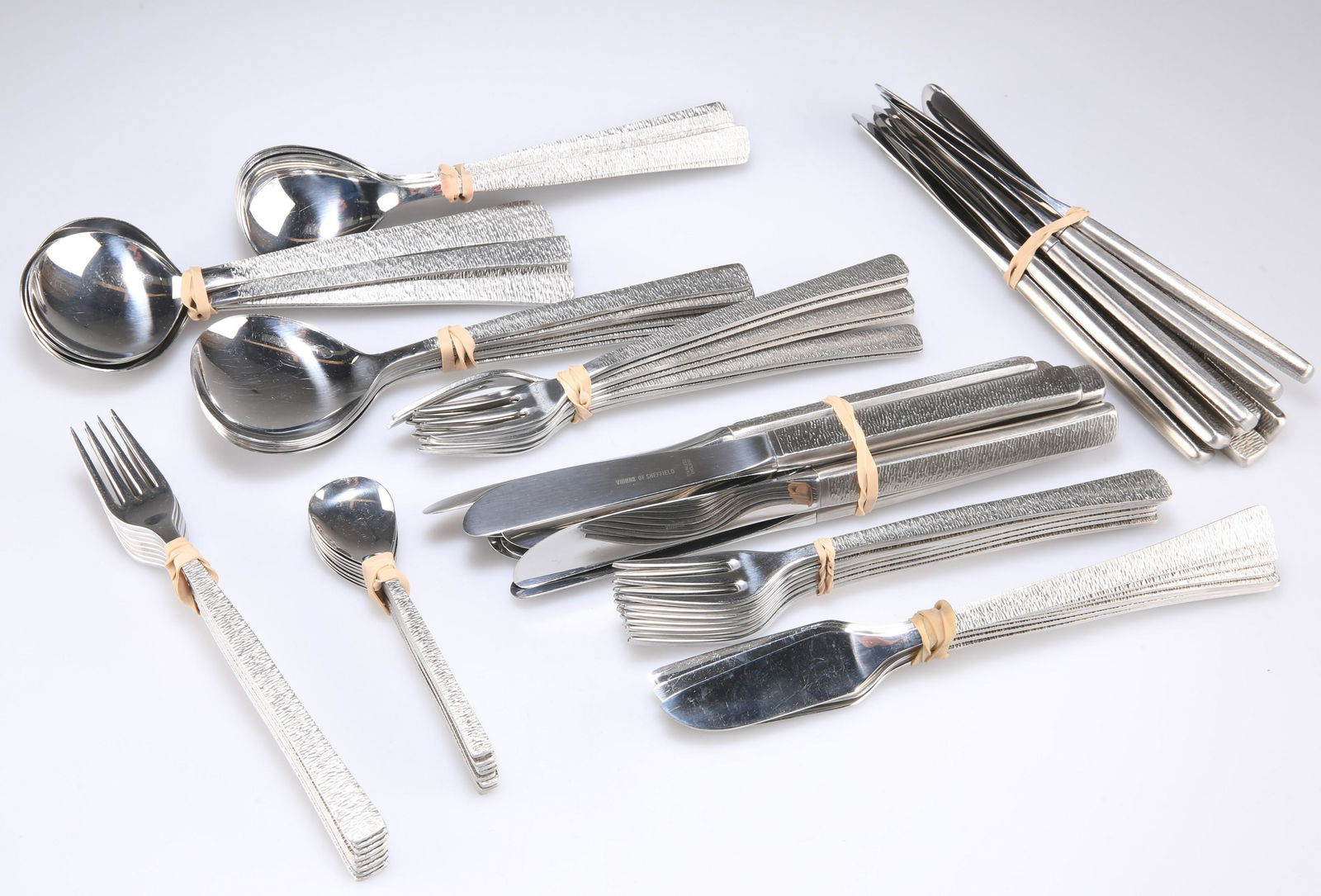 GERALD BENNEY FOR VINERS - STAINLESS STEEL 'STUDIO': GERALD BENNEY FOR VINERS - STAINLESS STEEL 'STUDIO' CUTLERY FOR EIGHT PERSONS, comprising dinner knives and forks, dessert knives, forks and spoons, fish knives and forks, soup spoons, coffee spoons a