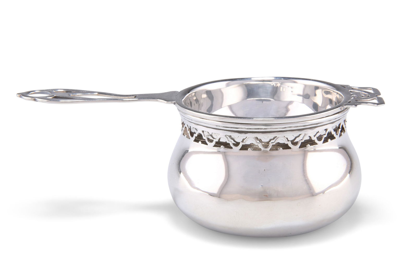 A GEORGE V SILVER TEA STRAINER AND BOWL, by Adie (1 of 3)