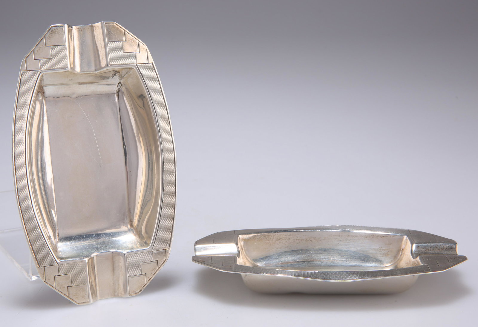 A PAIR OF ART DECO SILVER ASHTRAYS, by Collingwood & (1 of 2)