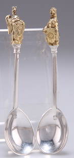 A PAIR OF ELIZABETH II SILVER AND PARCEL-GILT SPOONS,: A PAIR OF ELIZABETH II SILVER AND PARCEL-GILT SPOONS, by Richard Comyns, London 1973, each with heraldic terminal. (2) 11.5cm, 2.1 troy ounces