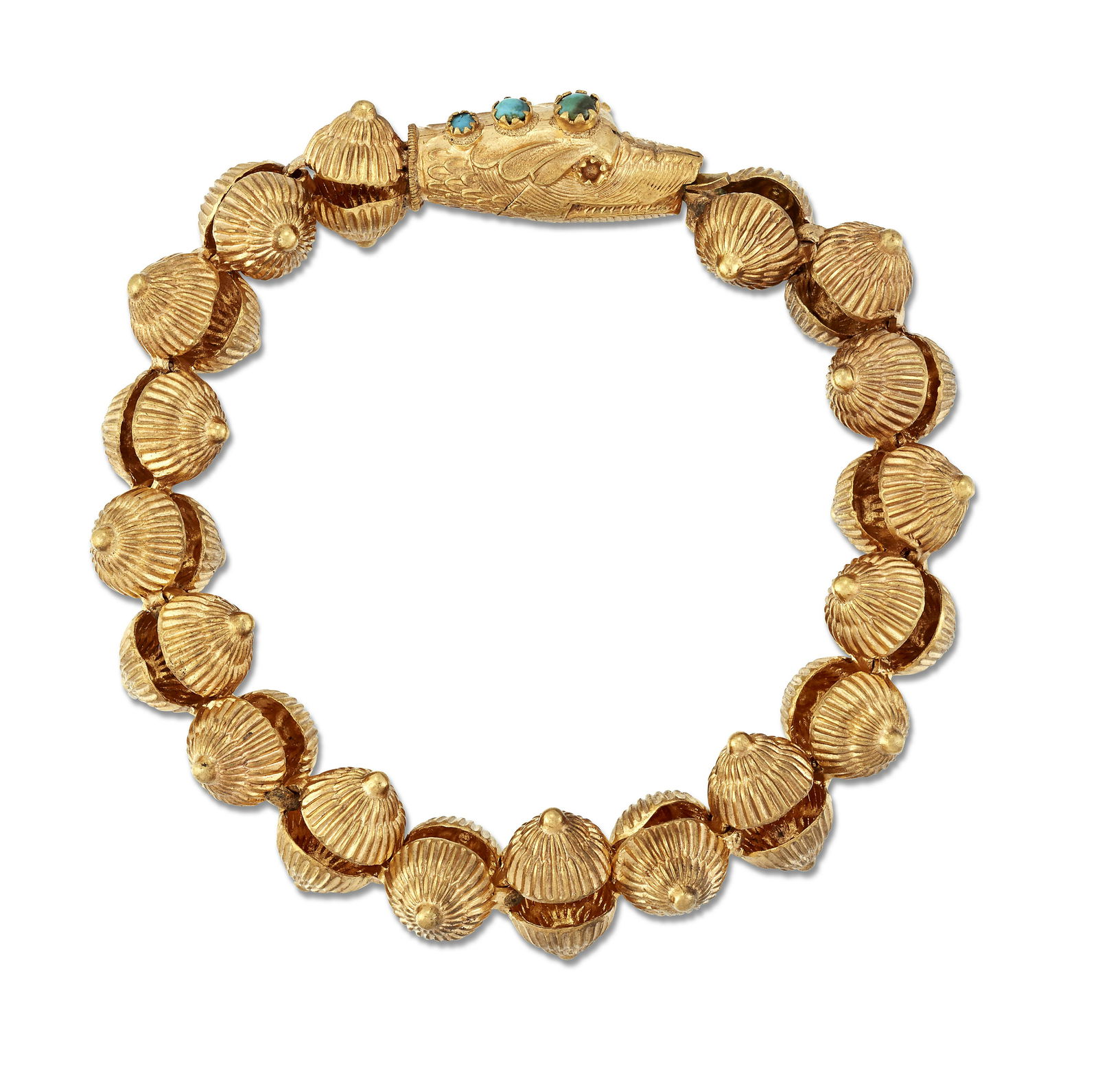 A TURQUOISE SERPENT AND SHELL BRACELET, modelled as a: A TURQUOISE SERPENT AND SHELL BRACELET, modelled as a serpent's head set with turquoise, to a body formed of cast shells. Length 19.5cm