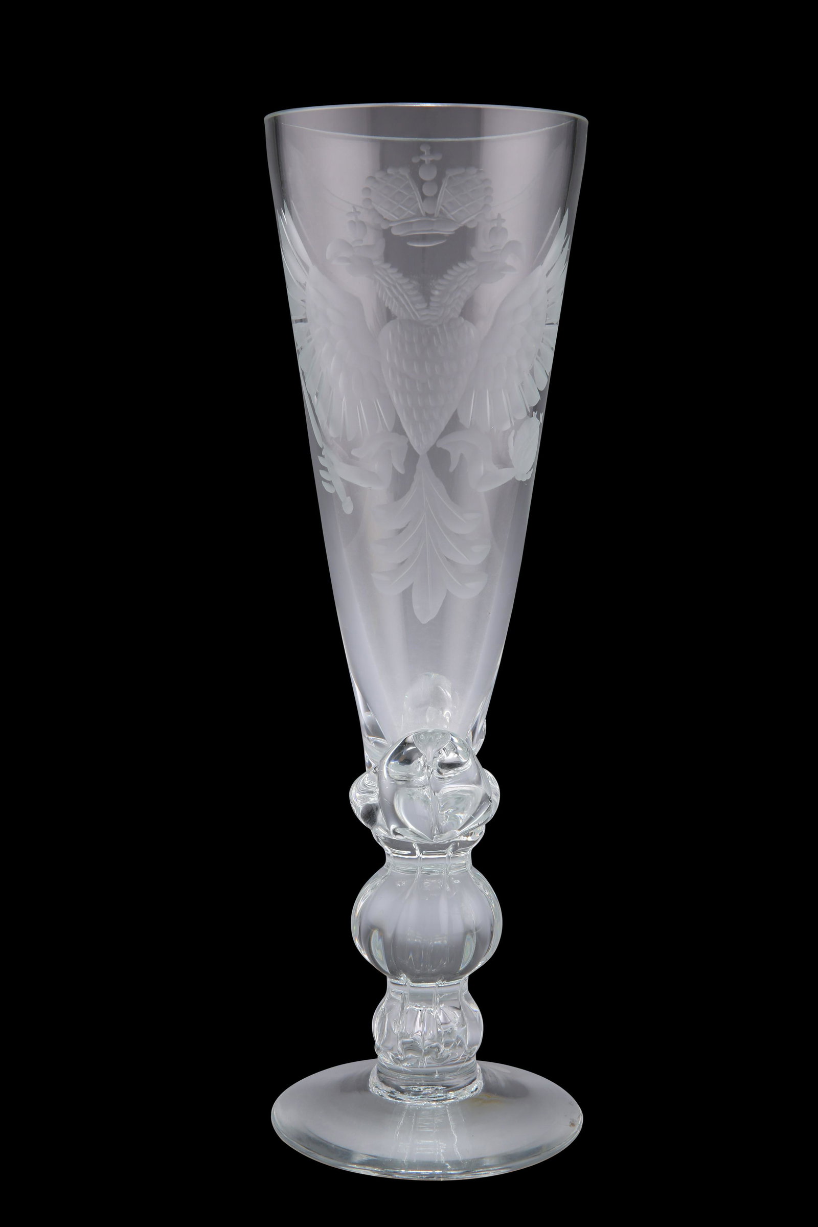 A LARGE GOBLET, CIRCA 1890, probably Bavarian or: A LARGE GOBLET, CIRCA 1890, probably Bavarian or Prussian, the elongated tapering bowl engraved with a double-headed eagle and coronet, raised on a plain foot. 25cm high