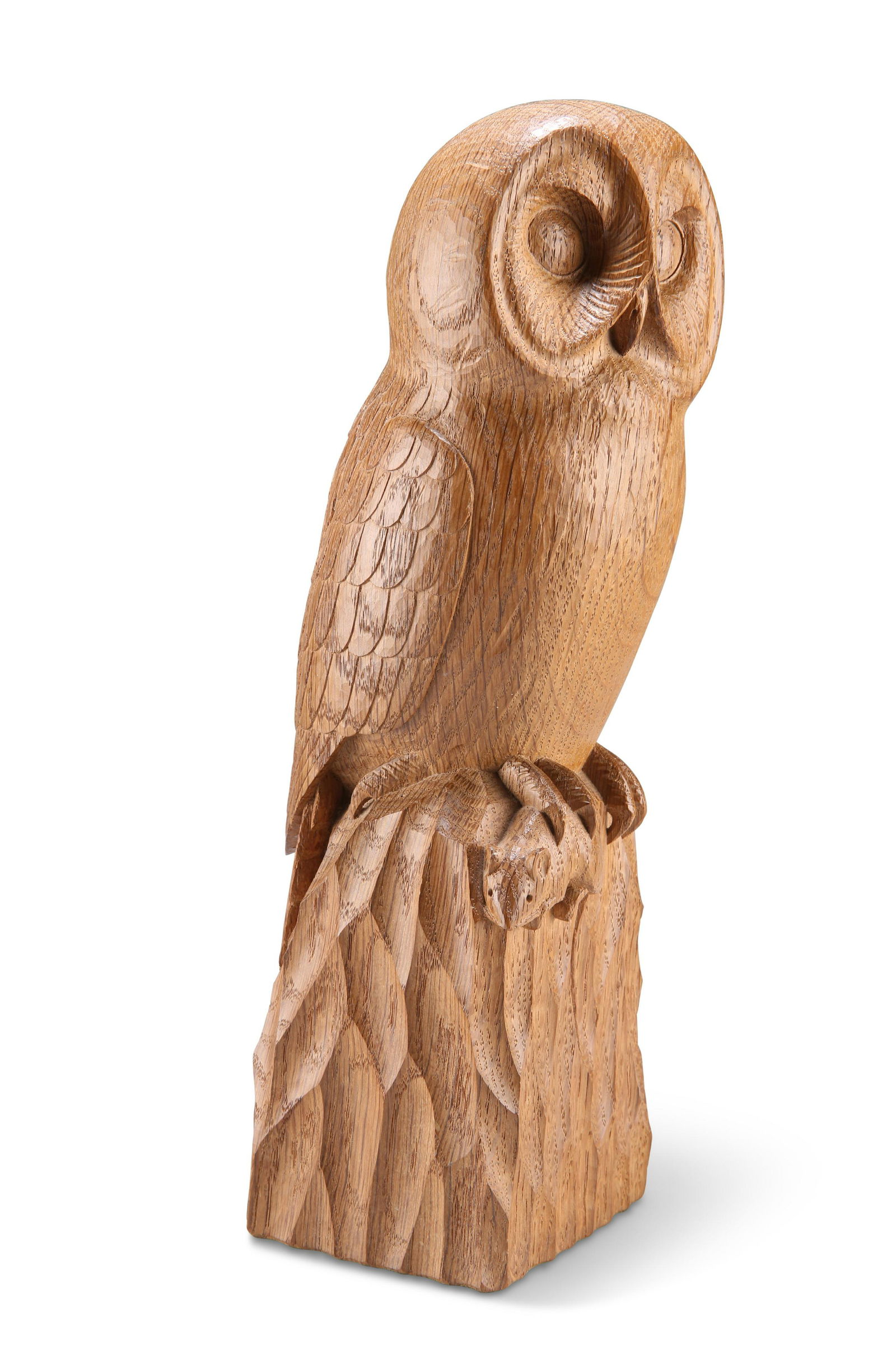 ROBERT THOMPSON OF KILBURN, A MOUSEMAN OAK OWL, carved: ROBERT THOMPSON OF KILBURN, A MOUSEMAN OAK OWL, carved as an owl standing on a naturalistic rocky base, holding a mouse in its talon. 31.5cm high A gift to the seller in 1975