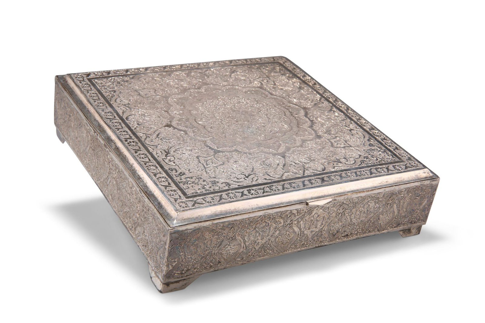 AN IRANIAN SILVER BOX, square, decorated to the hinged (1 of 1)