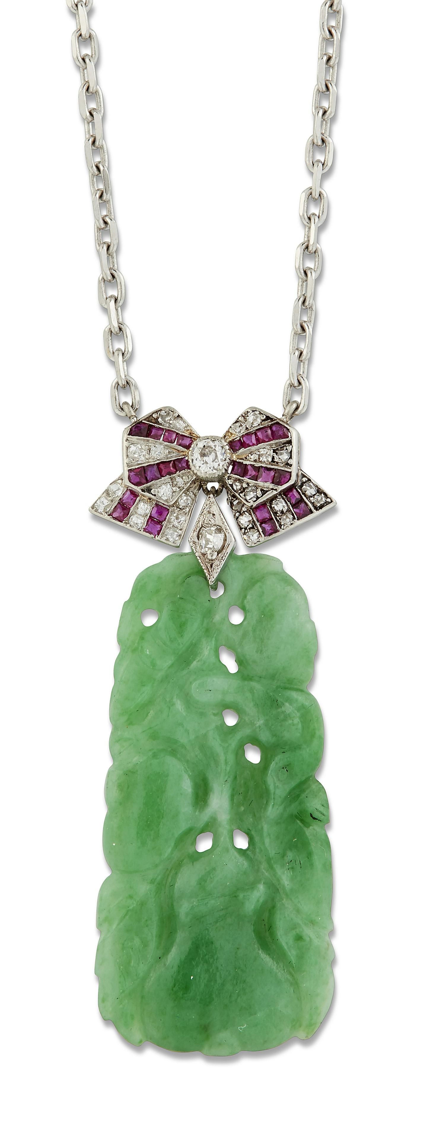 A JADE, DIAMOND AND RUBY PENDANT ON CHAIN, a carved and: A JADE, DIAMOND AND RUBY PENDANT ON CHAIN, a carved and pierced jade plaque depicting a bird and gourd, suspended from a ribbon bow surmount set with rose-cut diamonds and calibrÃ©-cut rubies, to a