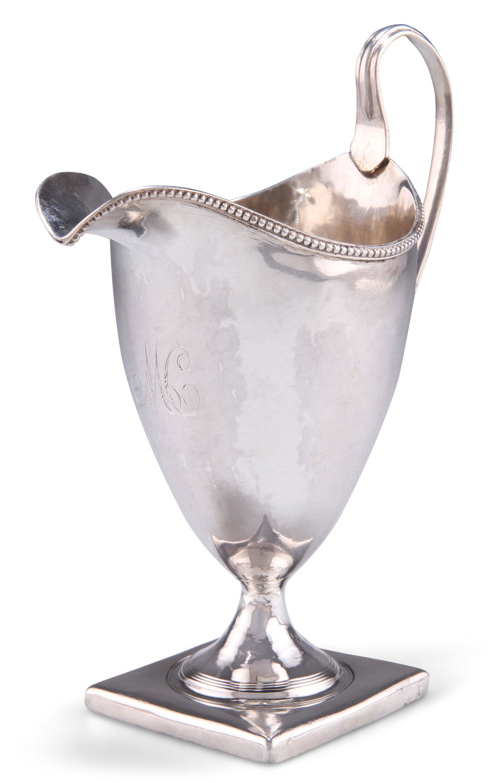 A GEORGE III SILVER CREAM JUG, by George Gray, London 1794,: A GEORGE III SILVER CREAM JUG, by George Gray, London 1794, helmet shaped, with beaded rim and square foot. 15cm high, 4.2 troy ounces