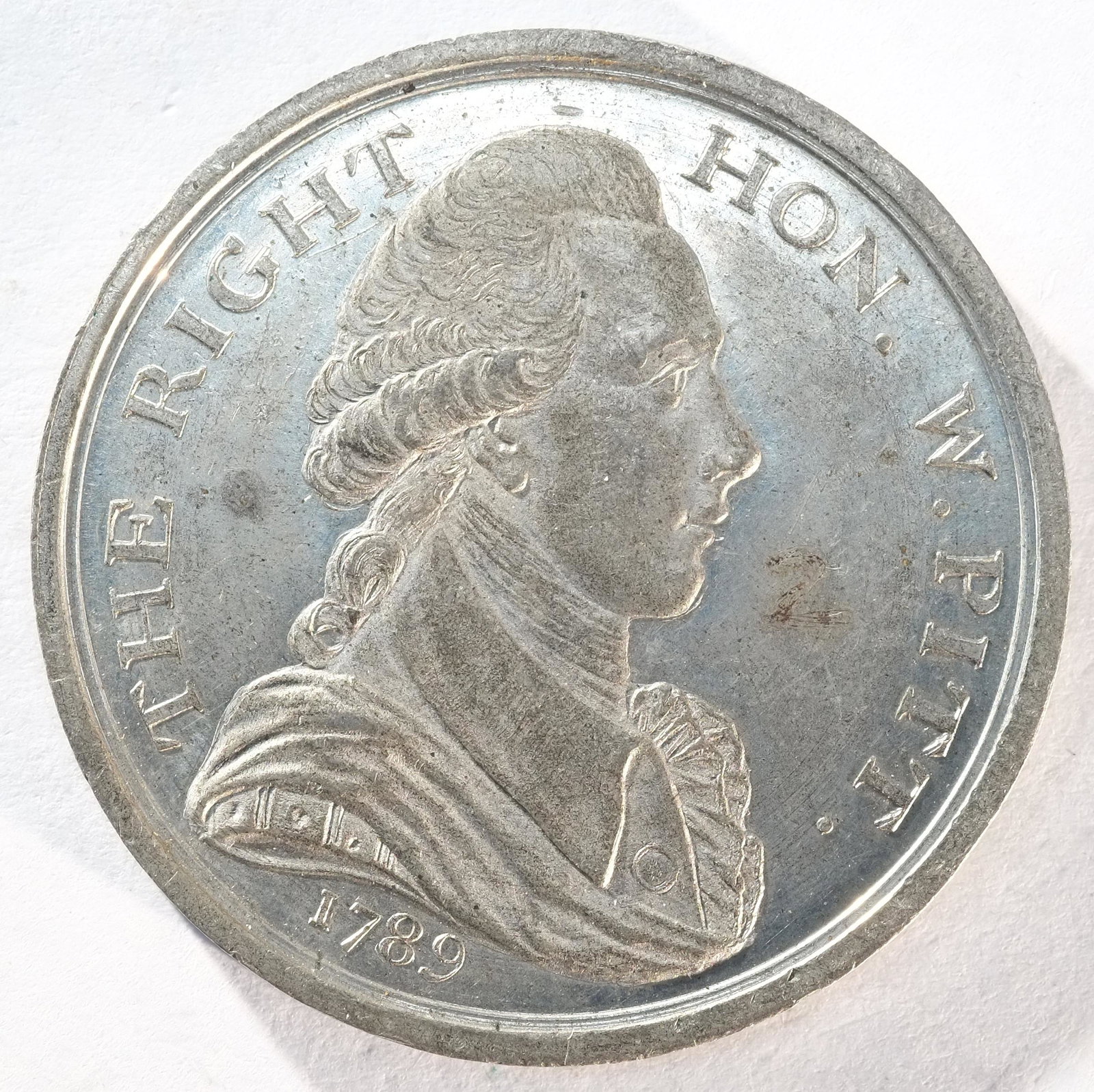 Lord Thurlow, 1789, a white metal medal by C. James and T. Wyon Jr. Obv: Bust of Lord Thurlow facing: Lord Thurlow, 1789, a white metal medal by C. James and T. Wyon Jr. Obv: Bust of Lord Thurlow facing left in hat. Rev: Bust of William Pitt right. DH Middlesex 219; BHM 331. Some rubbing in fields, ot