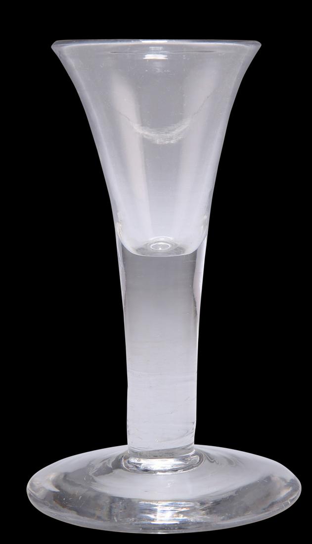AN 18TH CENTURY WINE GLASS, with drawn trumpet bowl and plain circular foot. 12.5cm high: AN 18TH CENTURY WINE GLASS, with drawn trumpet bowl and plain circular foot. 12.5cm high