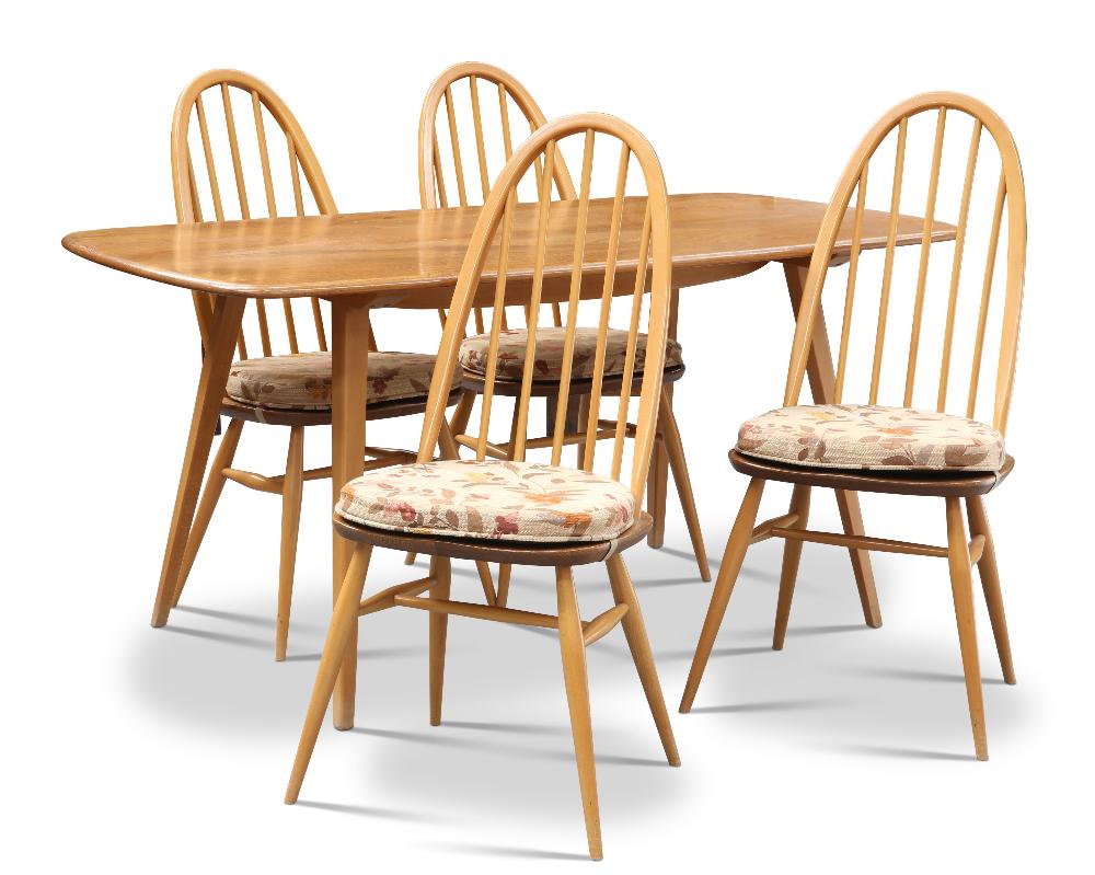 AN ERCOL LIGHT ELM DINING TABLE AND FOUR CHAIRS, the table with square-section tapering legs, the ch: AN ERCOL LIGHT ELM DINING TABLE AND FOUR CHAIRS, the table with square-section tapering legs, the chairs with spindle backs, old blue labels. (5) Table 71.5cm high, 152cm long, 77cm wide