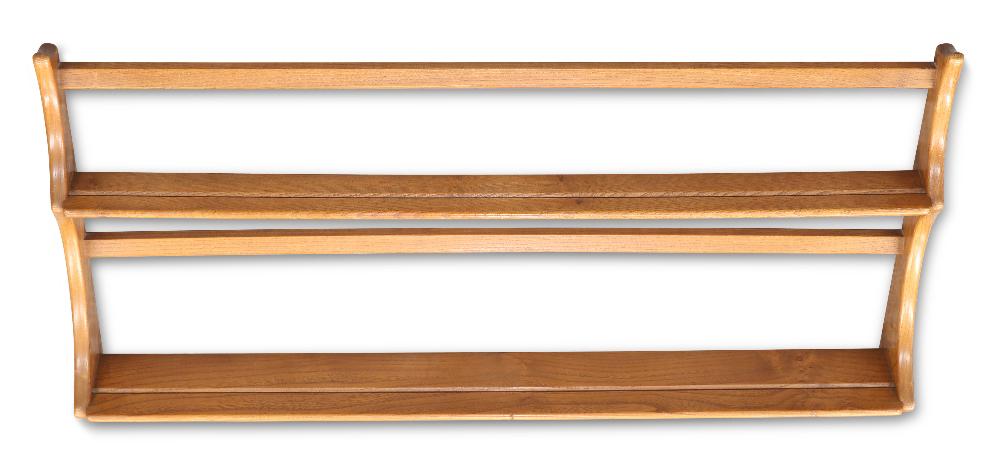AN ERCOL LIGHT ELM HANGING PLATE RACK, labelled; together with AN ERCOL LIGHT ELM CD CABINET, of nar: AN ERCOL LIGHT ELM HANGING PLATE RACK, labelled; together with AN ERCOL LIGHT ELM CD CABINET, of narrow proportions. (2) Cabinet 107.5cm high, 35cm wide, 21cm deep