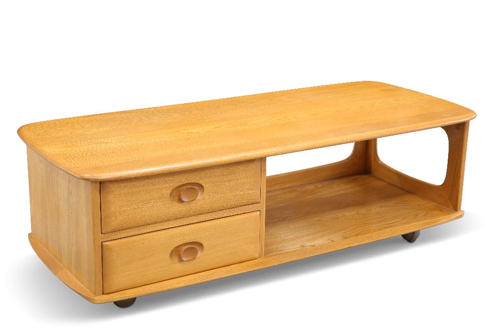 AN ERCOL 'MINERVA' LIGHT ELM TV STAND, shaped rectangular, fitted with two drawers, moving on castor: AN ERCOL 'MINERVA' LIGHT ELM TV STAND, shaped rectangular, fitted with two drawers, moving on castors. 39.5cm high, 124.5cm long, 53cm deep