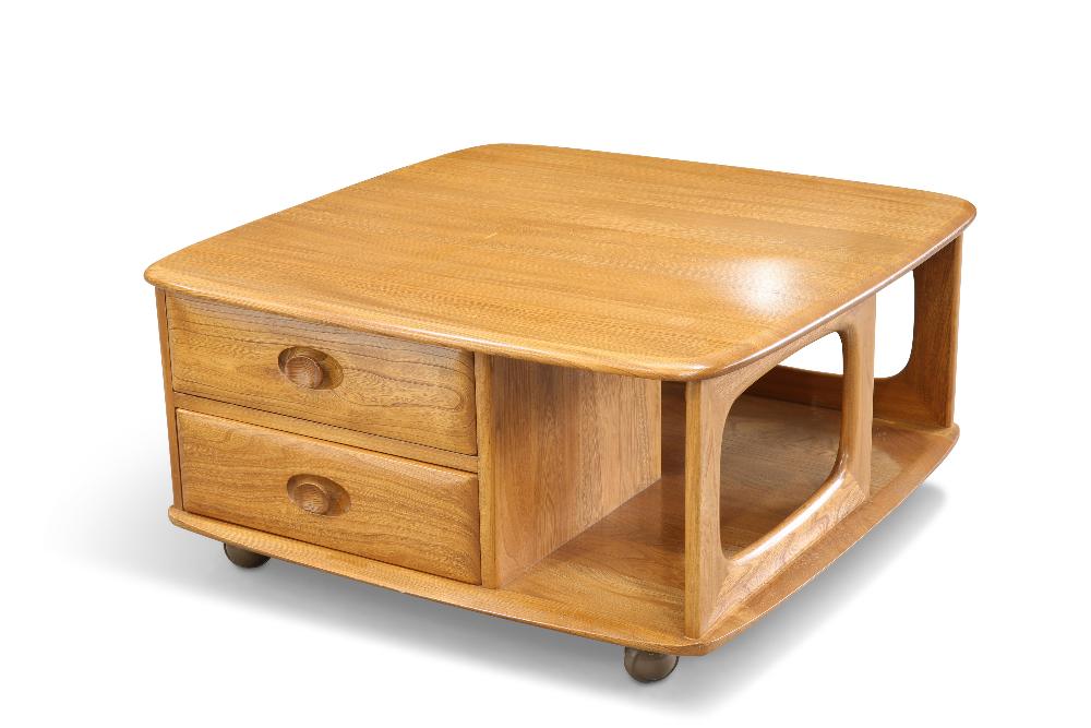 AN ERCOL 'PANDORA'S BOX' LIGHT ELM COFFEE TABLE, rounded square form, fitted with two drawers, movin: AN ERCOL 'PANDORA'S BOX' LIGHT ELM COFFEE TABLE, rounded square form, fitted with two drawers, moving on castors. 39.5cm high, 80cm square