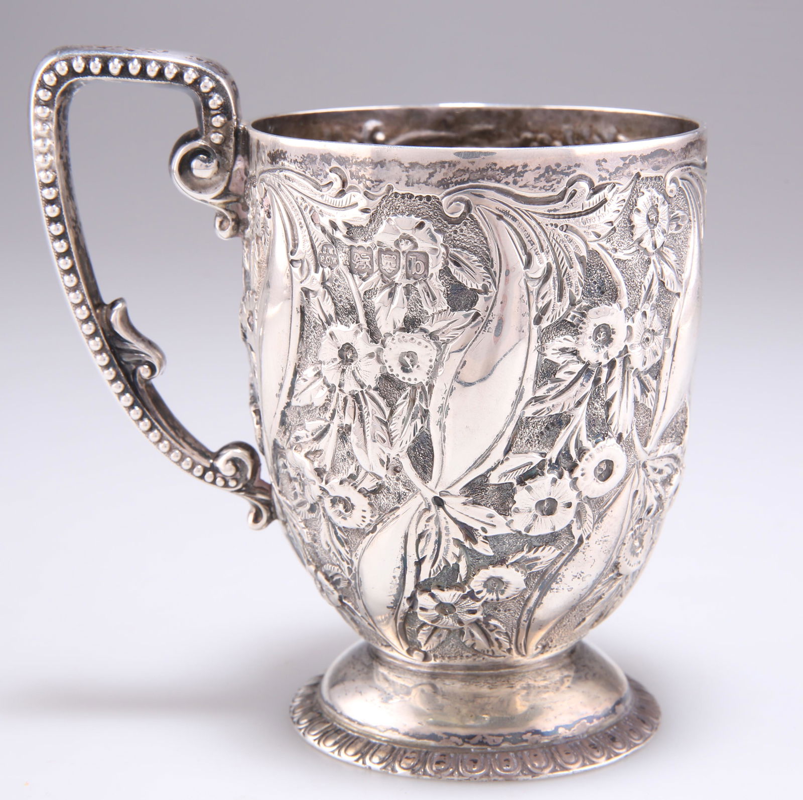 A VICTORIAN SILVER MUG, by James Wakely & Frank Clarke Wheeler, London 1897, with beaded handle, bol (1 of 1)
