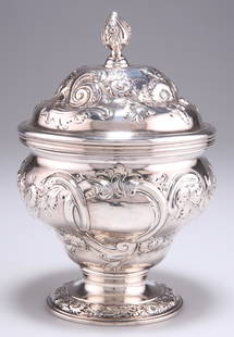 A GEORGE III SILVER SUGAR BOX, by William Grundy, London 1762, ogee form, chased with flowers, C-scr: A GEORGE III SILVER SUGAR BOX, by William Grundy, London 1762, ogee form, chased with flowers, C-scrolls and vacant cartouches. 17.5cm high, 19.9 troy ounces View 360 degree spin: