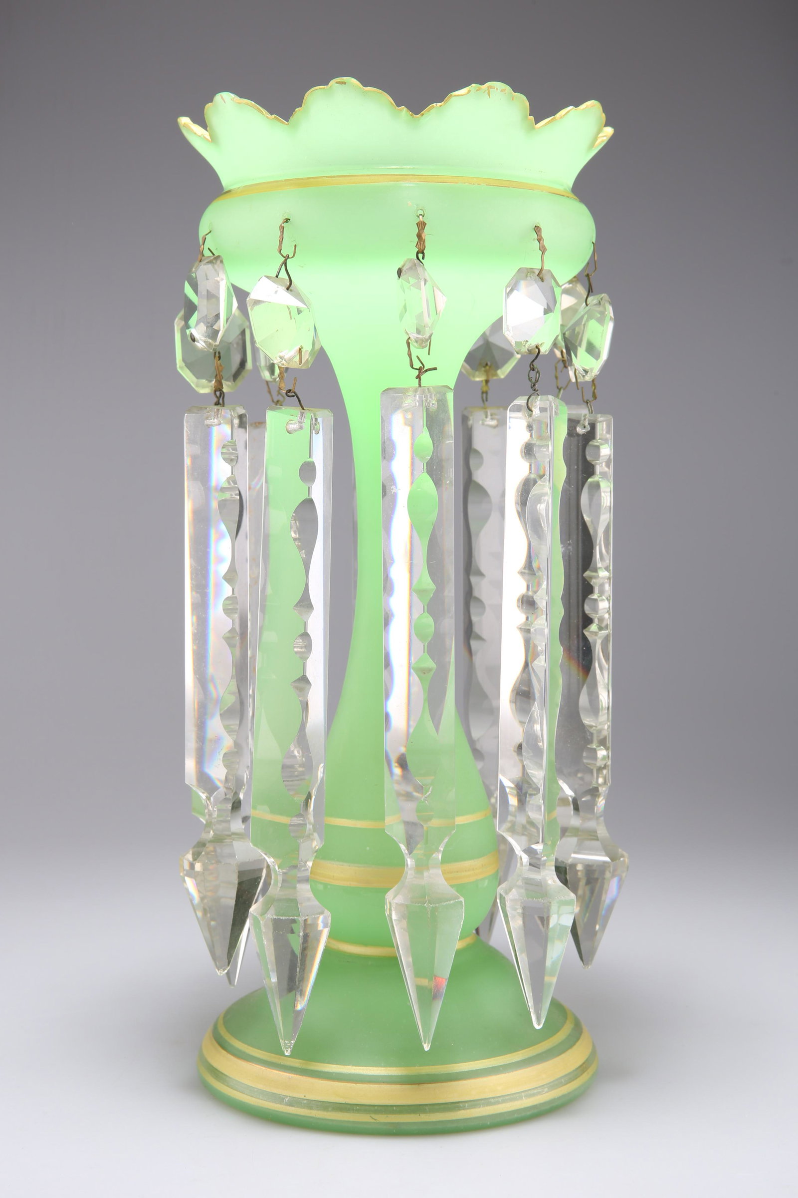 A VICTORIAN URANIUM GLASS TABLE LUSTRE, with crenelated rim and prismatic drops. 31.5cm high (1 of 1)
