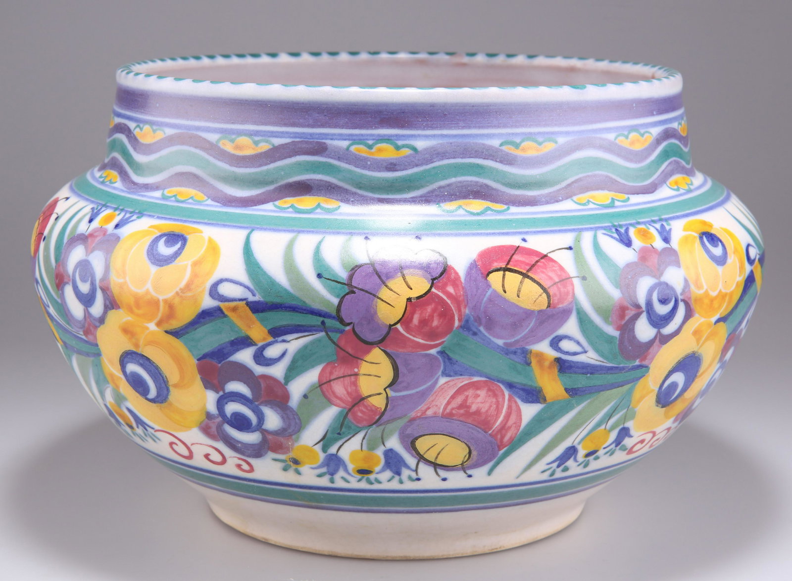 A CARTER STABLER ADAMS POOLE POTTERY â€˜YOâ€™ PATTERN JARDINIÃˆRE, CIRCA 1930S, of squat form with a (1 of 2)