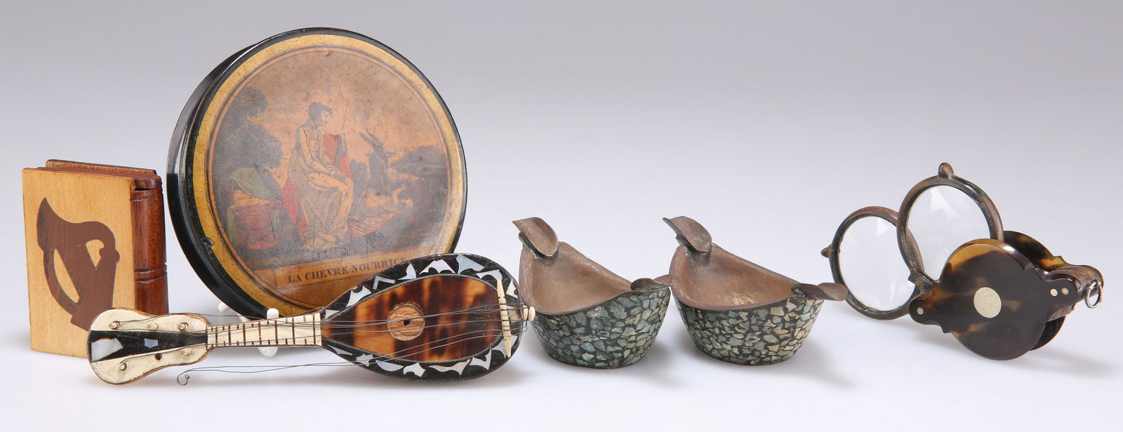 A 19TH CENTURY PAPIER-MÃ‚CHÃ‰ SNUFF BOX, 'LA CHEVRE NOURRICE', 9.5cm diameter; AN IRISH NOVELTY (1 of 1)