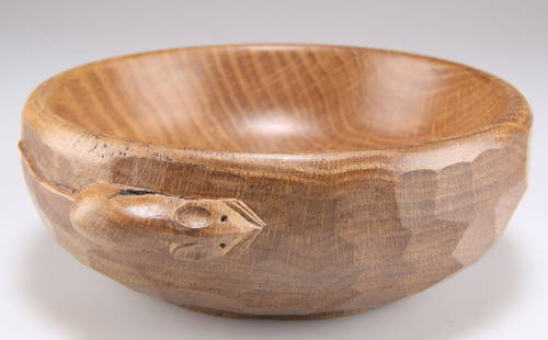 ROBERT THOMPSON OF KILBURN, A MOUSEMAN OAK NUT BOWL, with adzed exterior and carved mouse signature.: ROBERT THOMPSON OF KILBURN, A MOUSEMAN OAK NUT BOWL, with adzed exterior and carved mouse signature. 6cm by 15.5cm