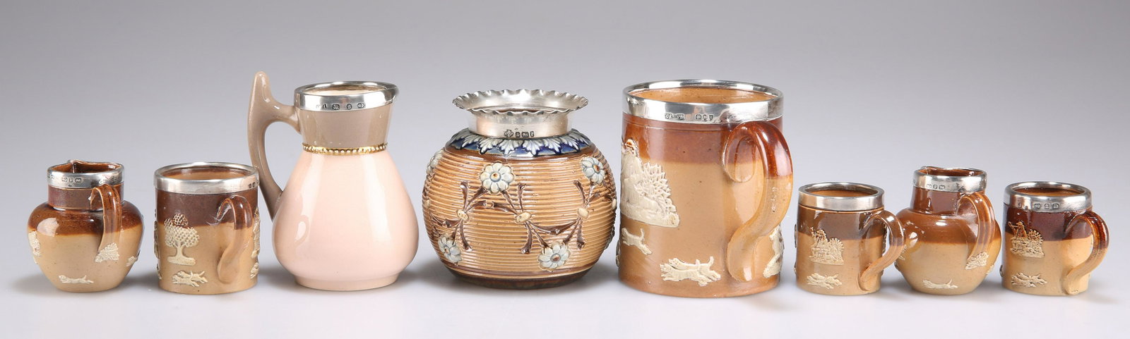 EIGHT DOULTON STONEWARE SILVER-MOUNTED ARTICLES (1 of 1)