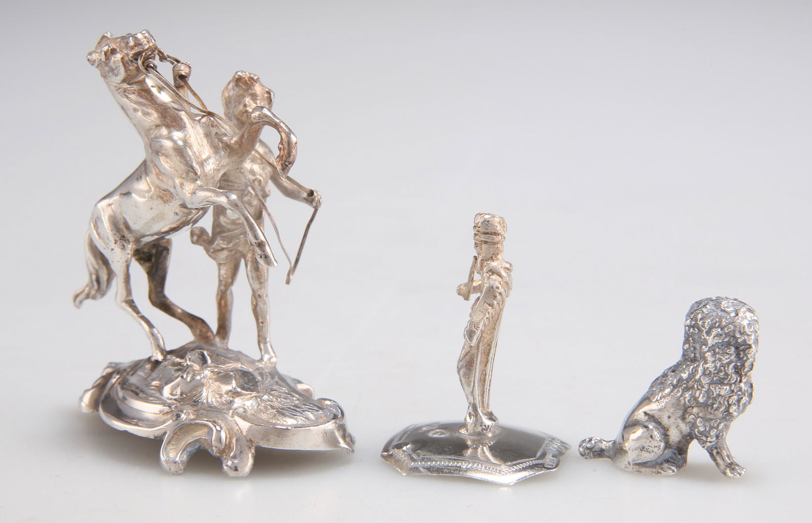 THREE MINIATURE SILVER IMPORT FIGURES (1 of 1)